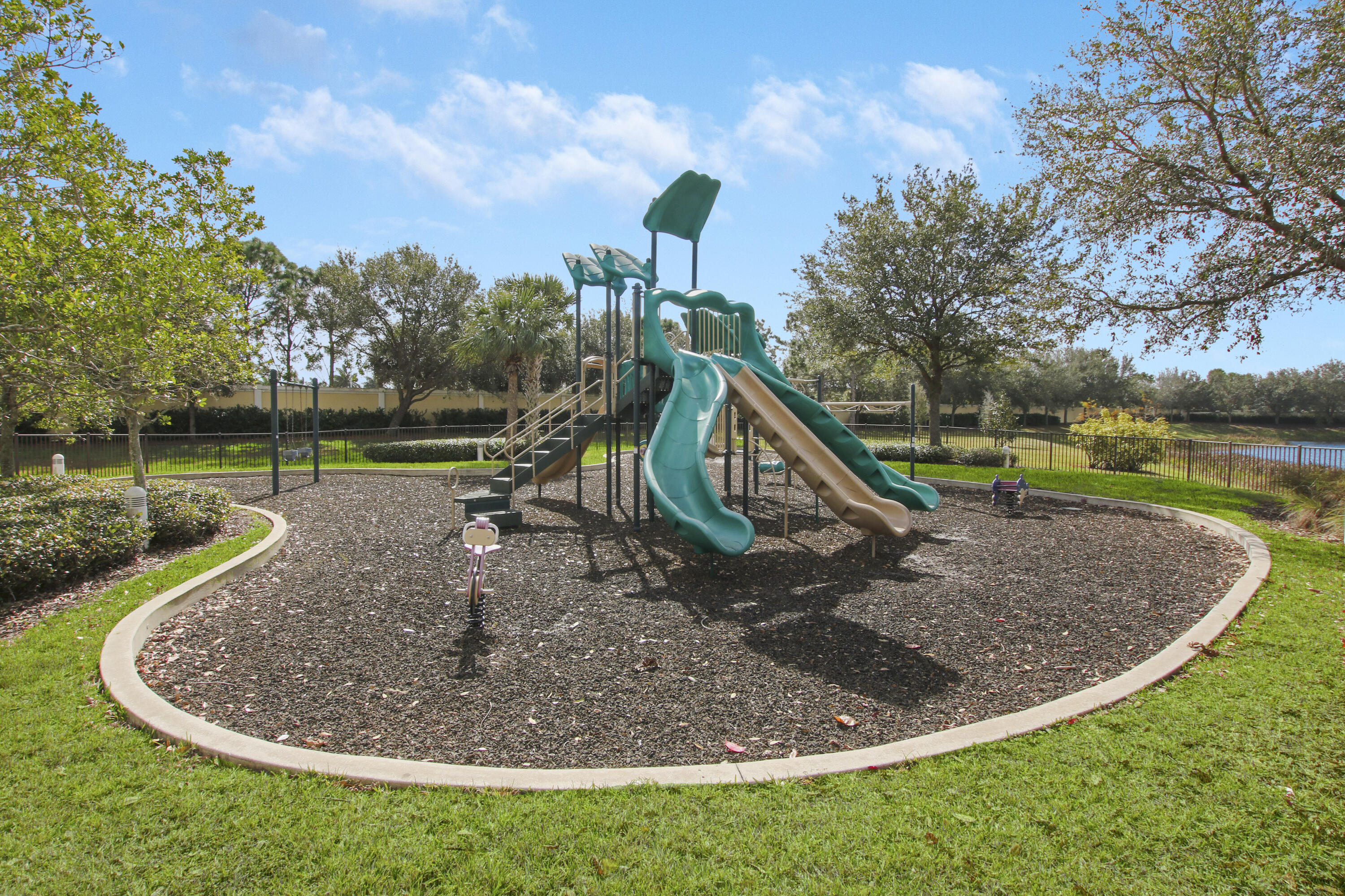 9212 Short Chip Circle Port St. Lucie, FL 34986 - Photo 57 of 71 a view of a park with large trees