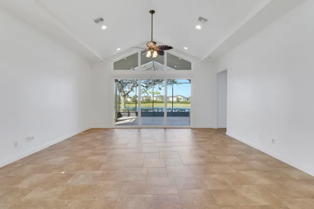 a view of a kitchen with a sink and refrigerator
