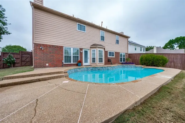 a view of a house with a swimming pool