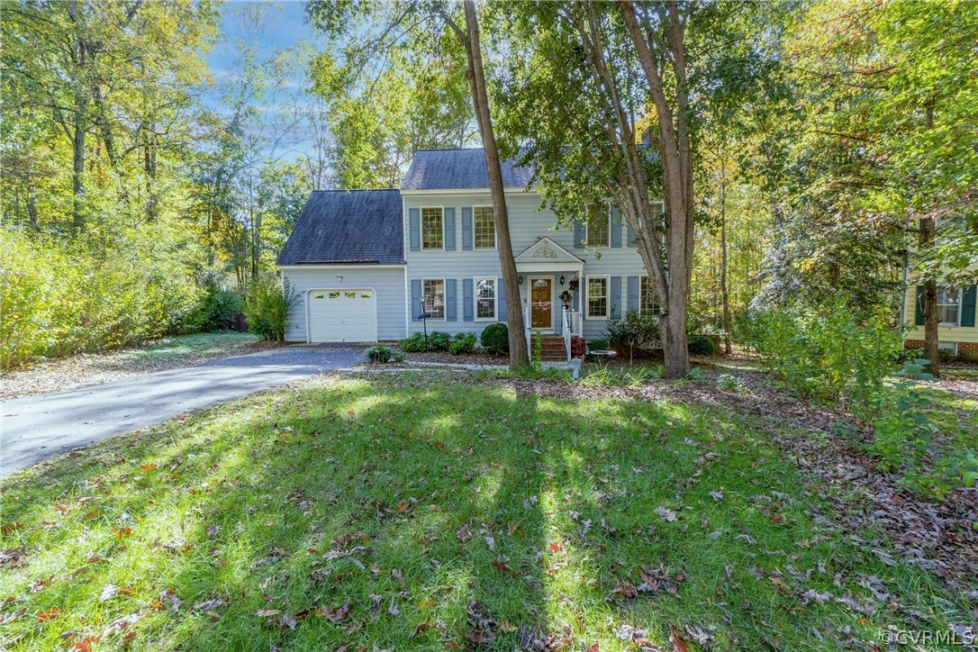 13816 Laurel Spring Road Chester, VA 23831 - Photo 2 of 31 a house view with a garden space