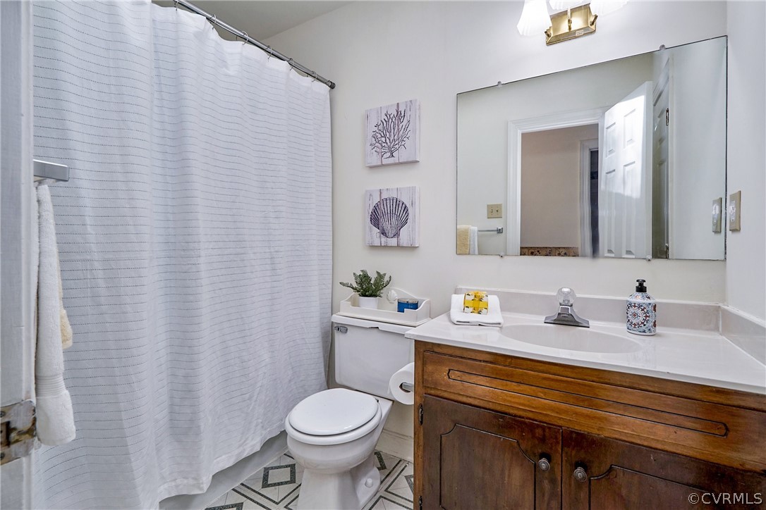 13816 Laurel Spring Road Chester, VA 23831 - Photo 21 of 31 a bathroom with a granite countertop sink and a mirror