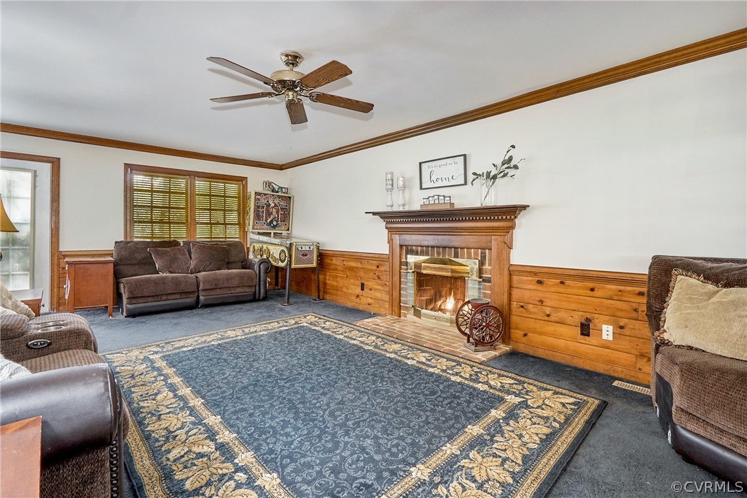 13816 Laurel Spring Road Chester, VA 23831 - Photo 6 of 31 a living room with furniture and a fireplace