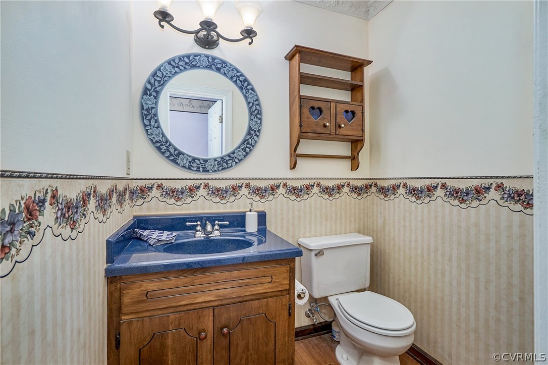 13816 Laurel Spring Road Chester, VA 23831 - Photo 9 of 31 a bathroom with a toilet and a sink