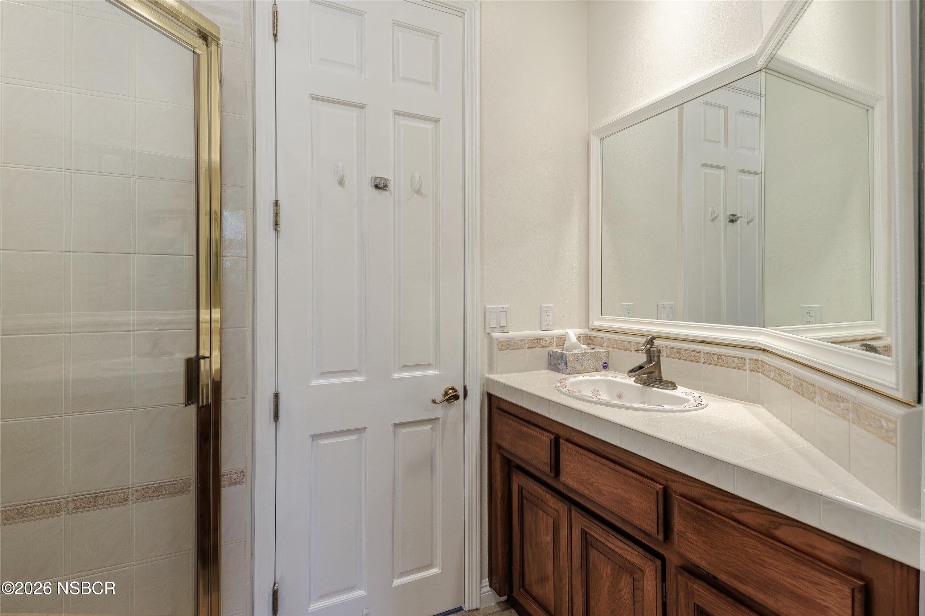 2655 Adobe Falls Road Lompoc, CA 93436 - Photo 34 of 51 a bathroom with a sink and a mirror