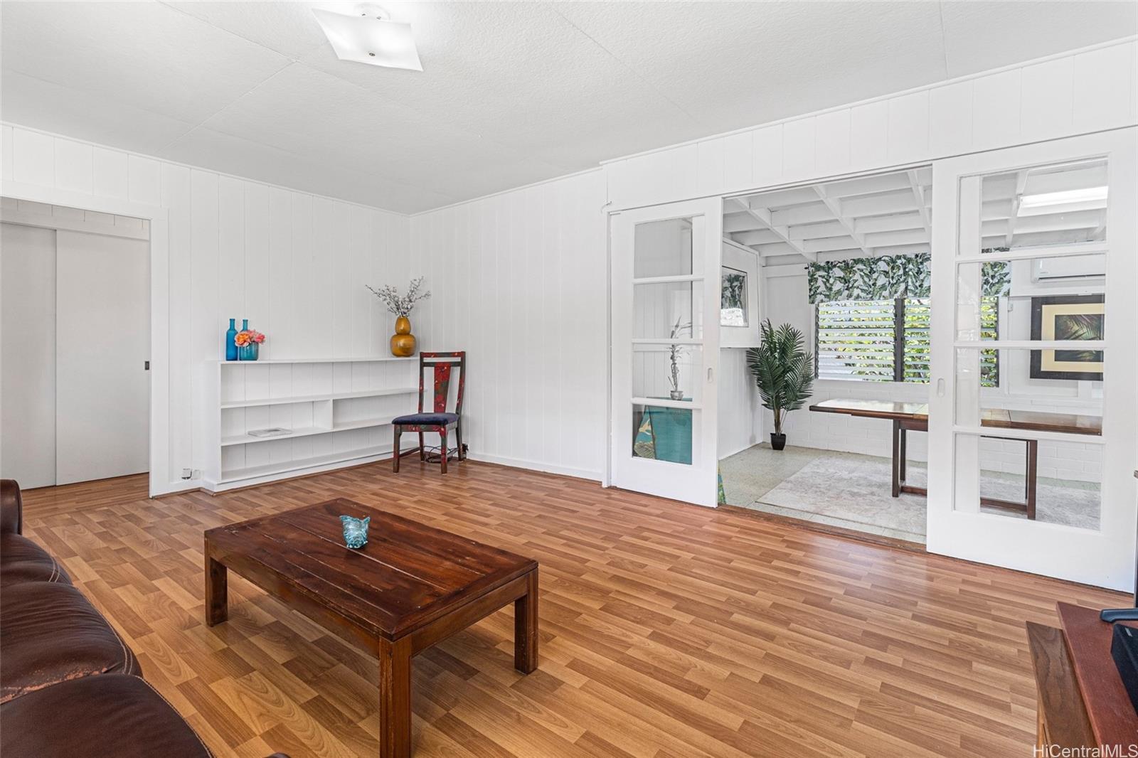259 Kuliouou Road Honolulu, HI 96821 - Photo 1 of 1 a living room with furniture and a wooden floor