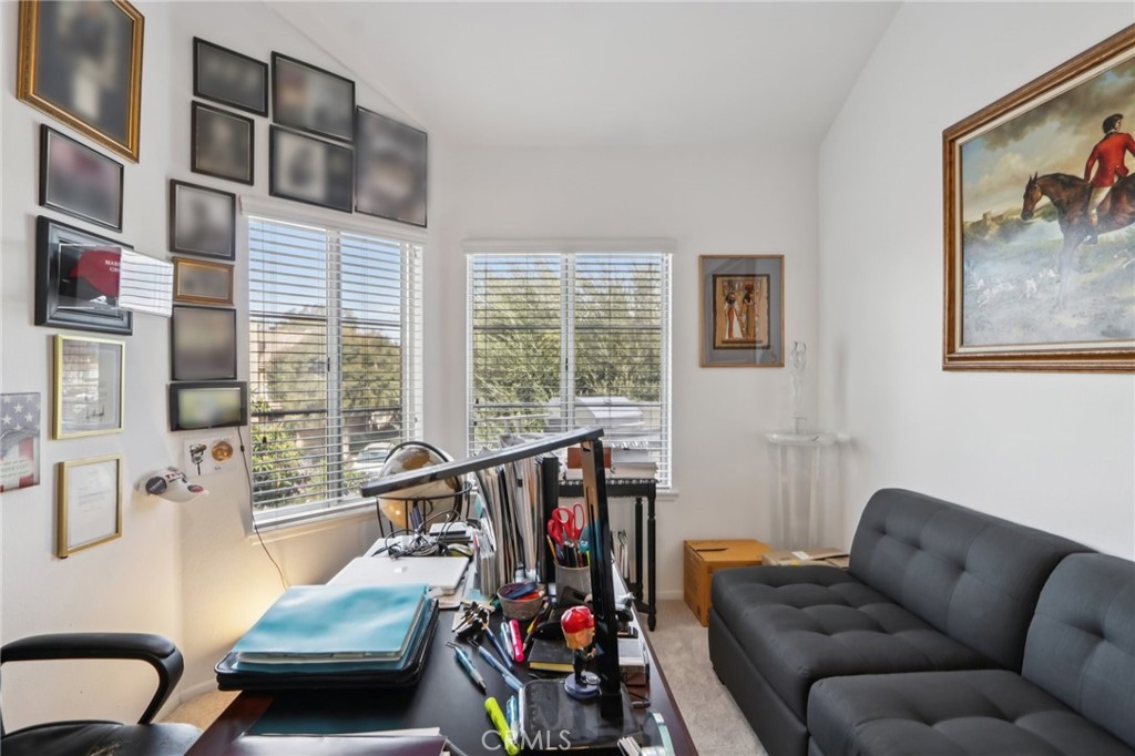 23605 Del Monte Dr., Unit 252 Valencia, CA 91355 - Photo 15 of 48 a living room with furniture and a floor to ceiling window