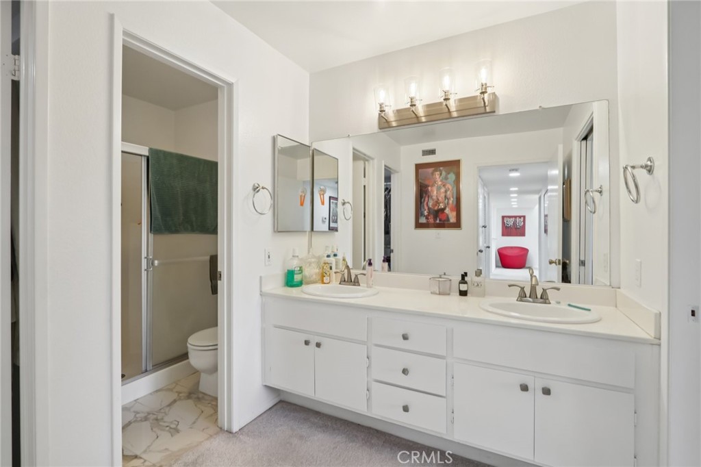 23605 Del Monte Dr., Unit 252 Valencia, CA 91355 - Photo 23 of 48 a bathroom with a double vanity sink mirror and a