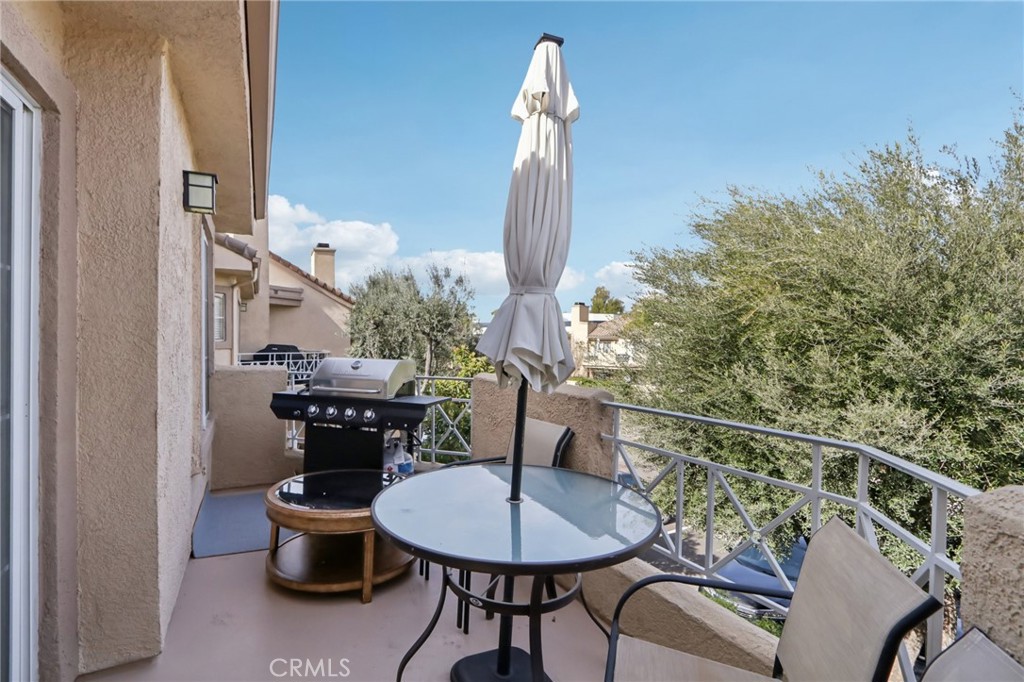 23605 Del Monte Dr., Unit 252 Valencia, CA 91355 - Photo 25 of 48 a dining room with furniture and wooden floor