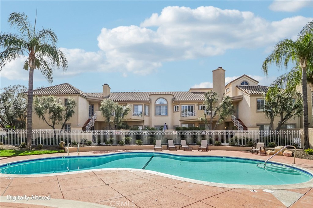 23605 Del Monte Dr., Unit 252 Valencia, CA 91355 - Photo 29 of 48 a front view of house with yard and green space