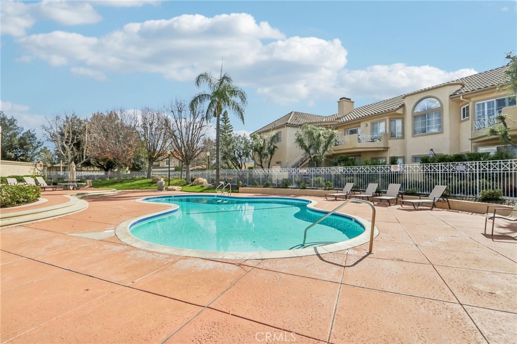 23605 Del Monte Dr., Unit 252 Valencia, CA 91355 - Photo 30 of 48 a swimming pool with outdoor seating yard and barbeque oven