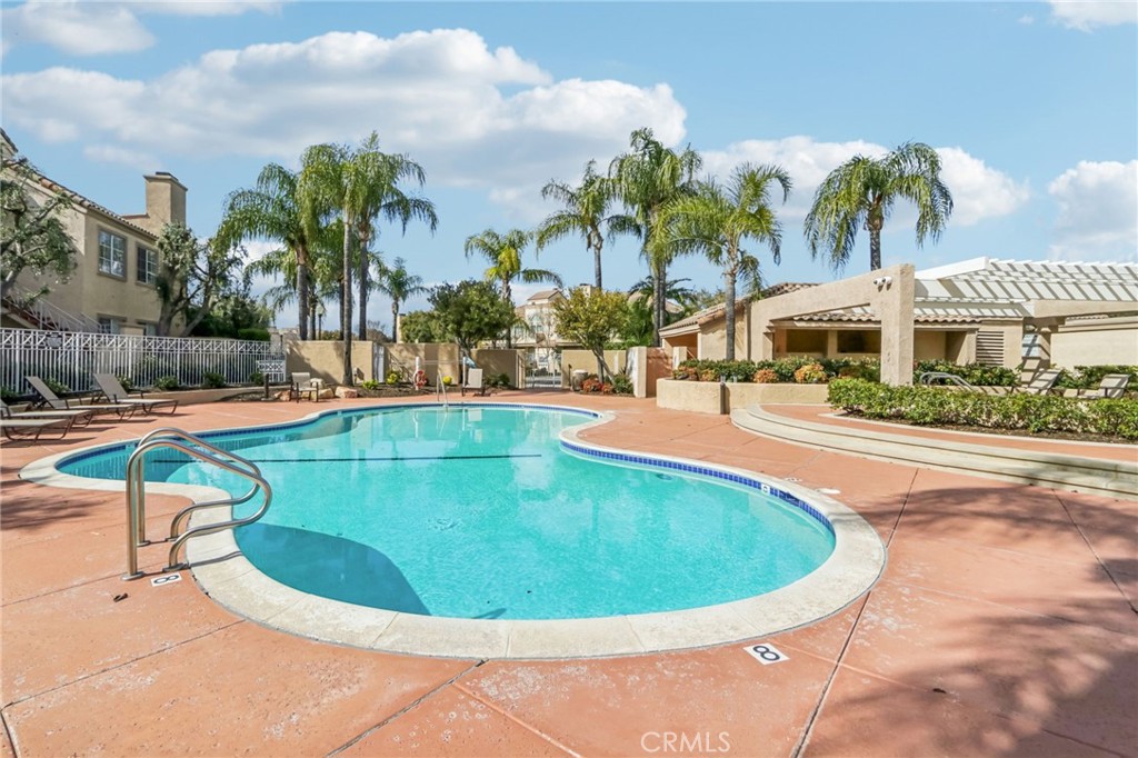 23605 Del Monte Dr., Unit 252 Valencia, CA 91355 - Photo 33 of 48 a view of a swimming pool with a patio