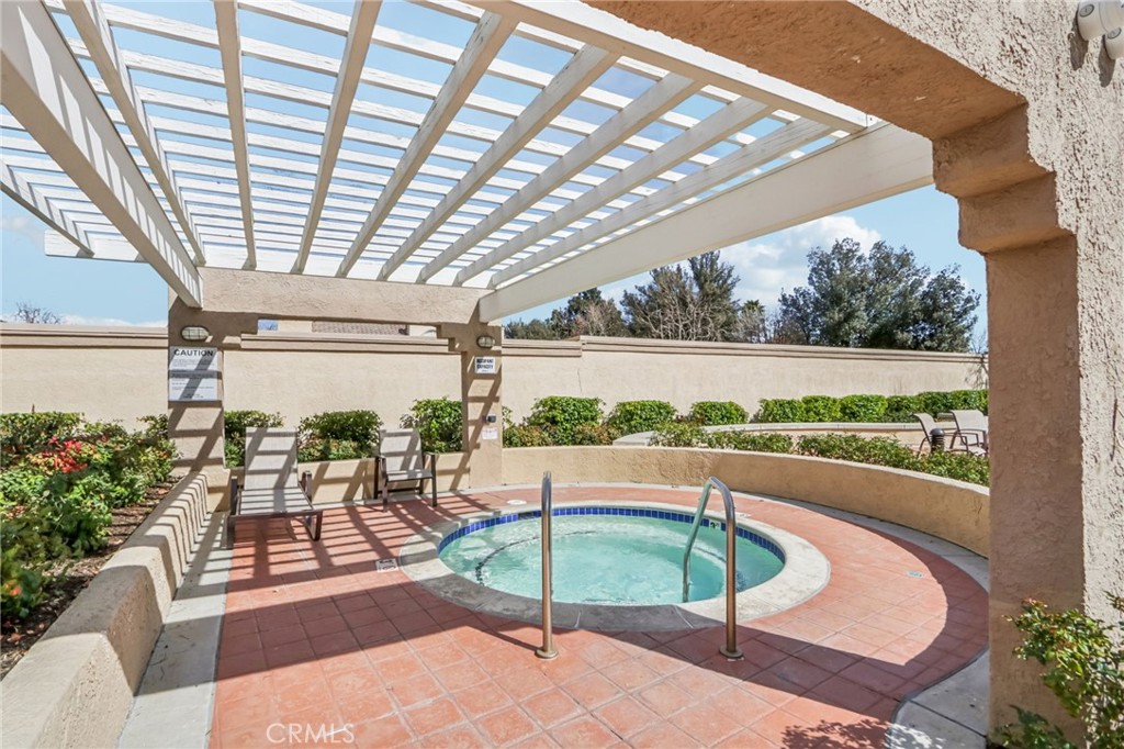 23605 Del Monte Dr., Unit 252 Valencia, CA 91355 - Photo 35 of 48 a building outdoor space with patio couches and potted plants