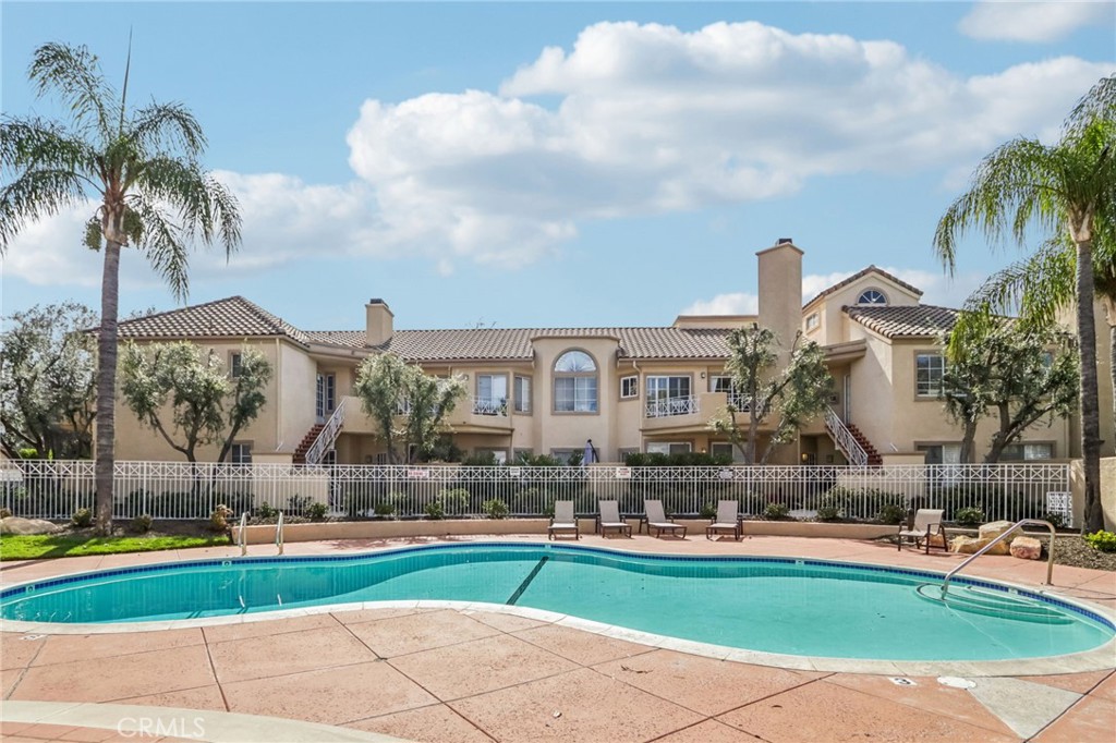 23605 Del Monte Dr., Unit 252 Valencia, CA 91355 - Photo 37 of 48 a front view of house with yard and outdoor seating