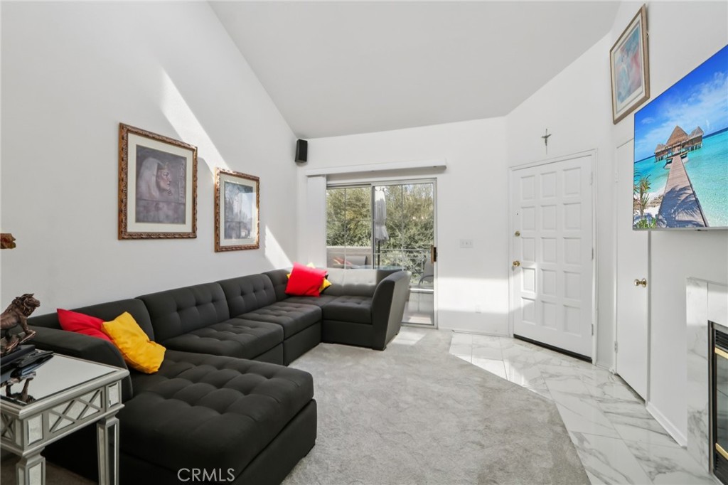 23605 Del Monte Dr., Unit 252 Valencia, CA 91355 - Photo 3 of 48 a living room with furniture and a window
