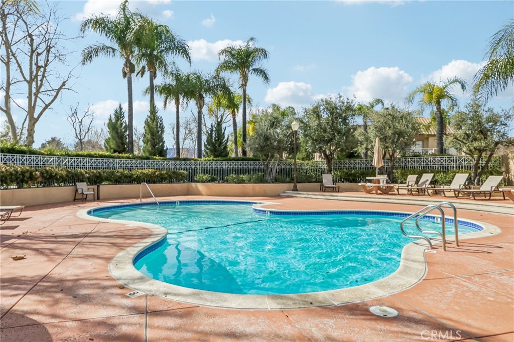 23605 Del Monte Dr., Unit 252 Valencia, CA 91355 - Photo 40 of 48 a view of a swimming pool with an outdoor space