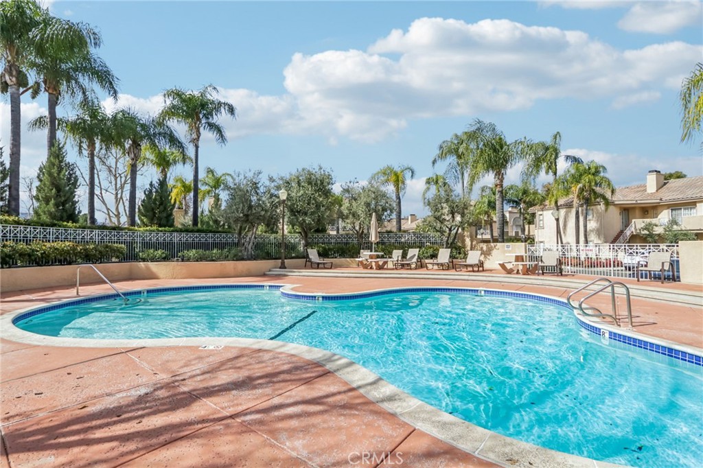 23605 Del Monte Dr., Unit 252 Valencia, CA 91355 - Photo 42 of 48 a view of swimming pool with palm trees