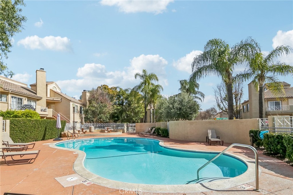 23605 Del Monte Dr., Unit 252 Valencia, CA 91355 - Photo 46 of 48 a view of a swimming pool with a patio