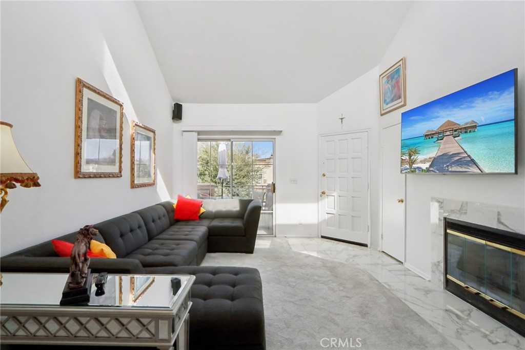 23605 Del Monte Dr., Unit 252 Valencia, CA 91355 - Photo 5 of 48 a living room with furniture and a fireplace