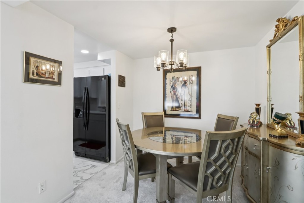 23605 Del Monte Dr., Unit 252 Valencia, CA 91355 - Photo 9 of 48 a view of a dining room with furniture