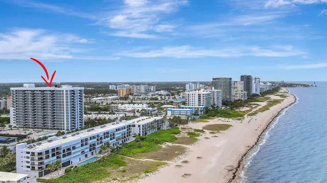 a living room with furniture pool table and a window