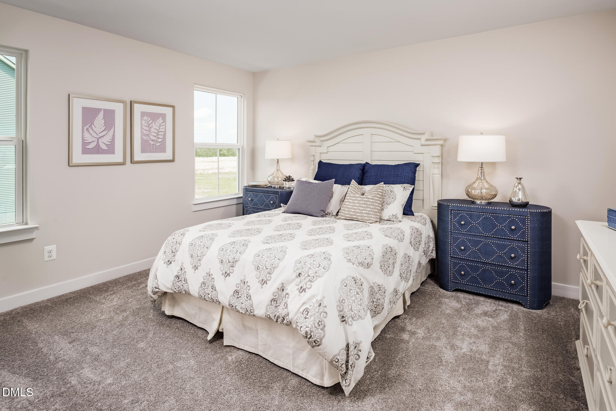 817 Walker Rdg Way Willow Spring, NC 27592 - Photo 20 of 23 a bedroom with a bed a lamp and a window