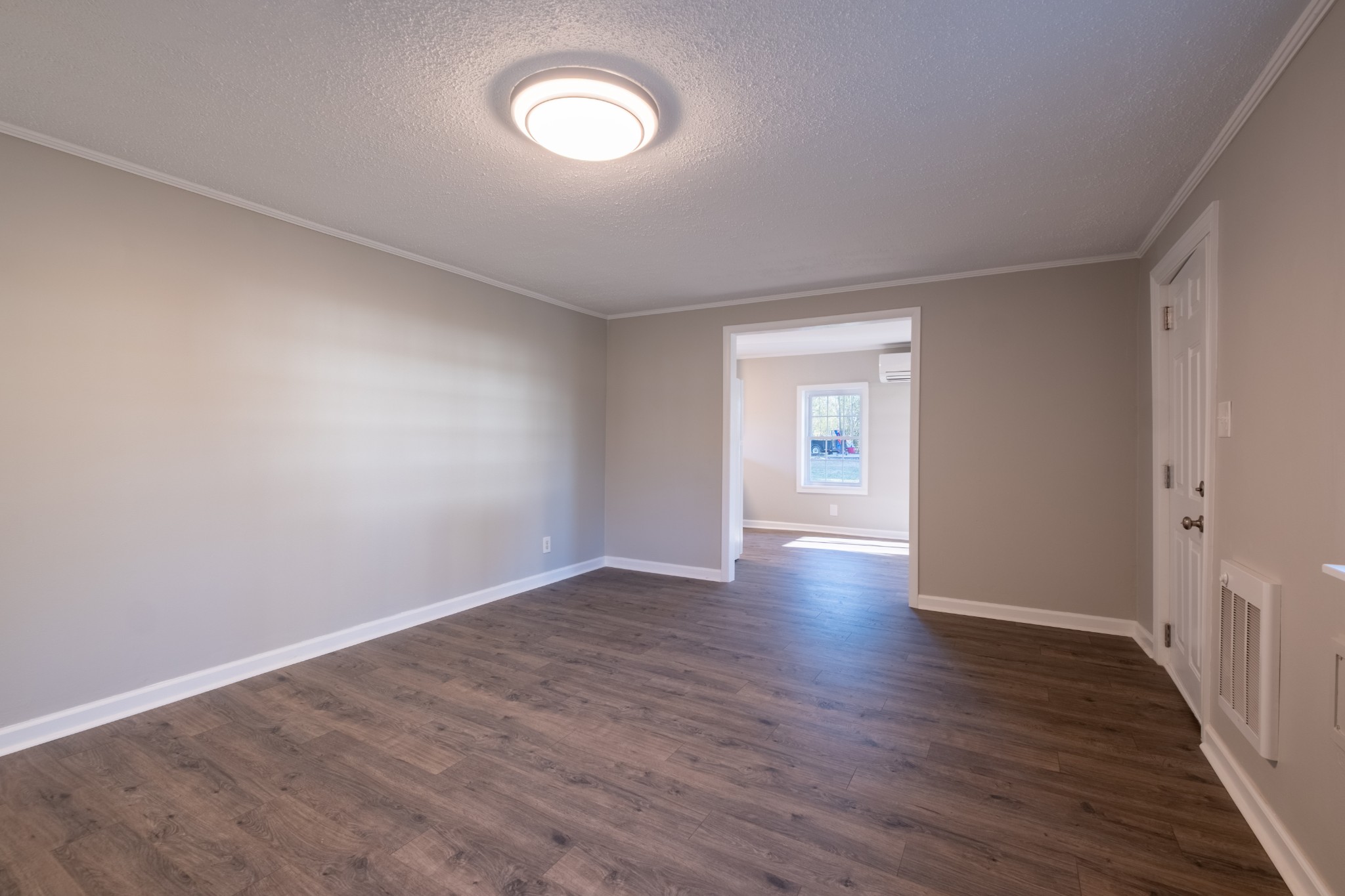 316 South Maple Street Tullahoma, TN 37388 - Photo 11 of 21 a view of an empty room with wooden floor and a window