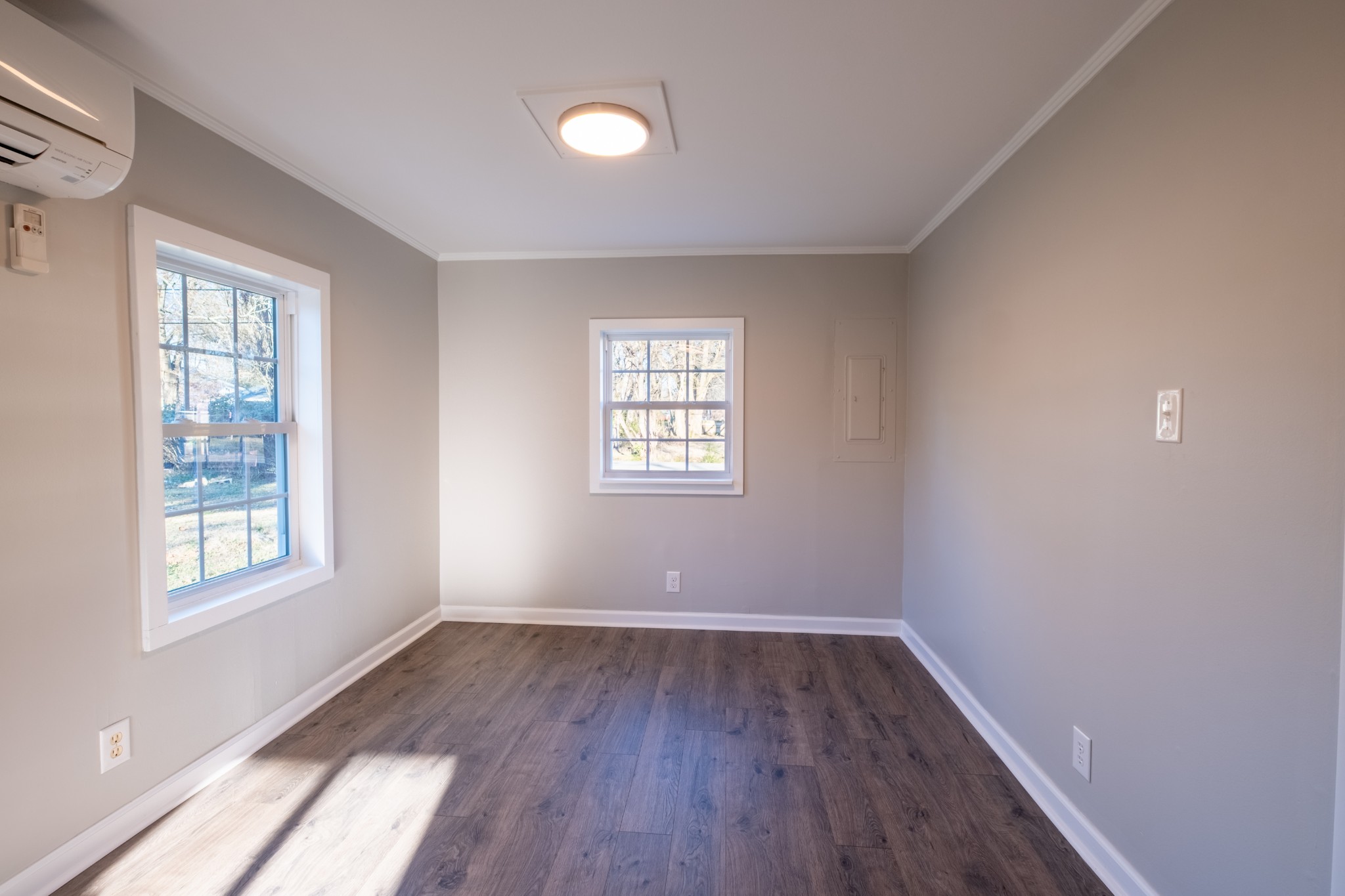 316 South Maple Street Tullahoma, TN 37388 - Photo 13 of 21 an empty room with wooden floor and windows