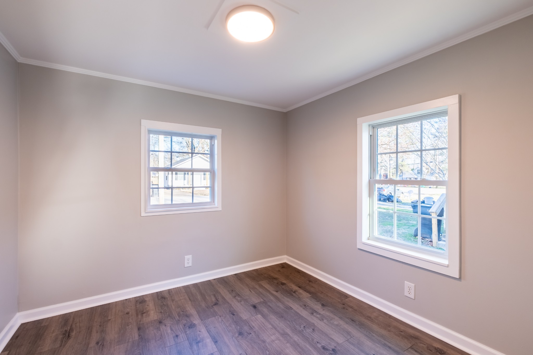 316 South Maple Street Tullahoma, TN 37388 - Photo 17 of 21 an empty room with wooden floor and windows
