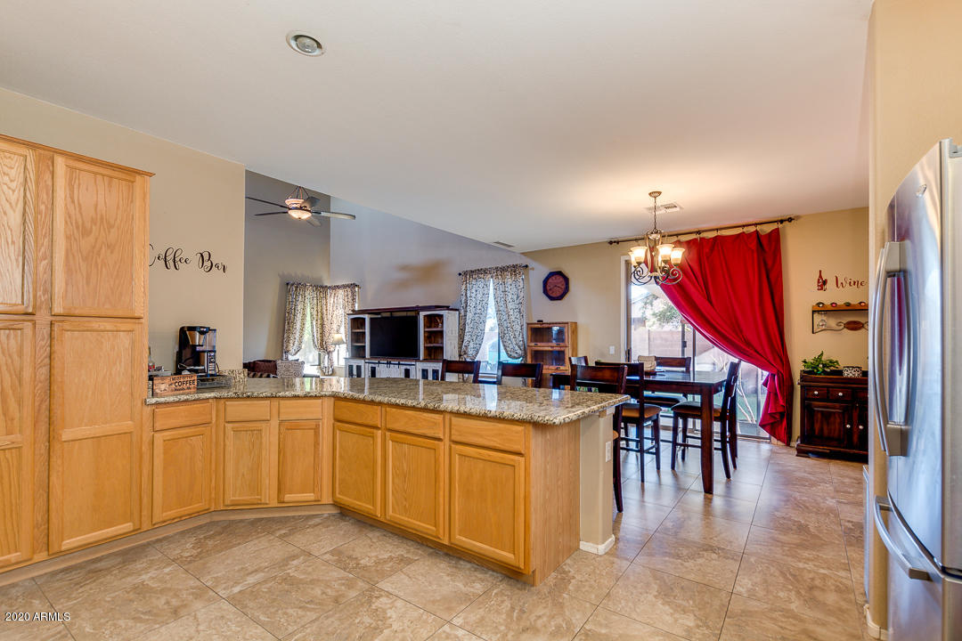 1163 East Ranch Court Gilbert, AZ 85296 - Photo 11 of 36 a kitchen with lots of counter top space and appliances