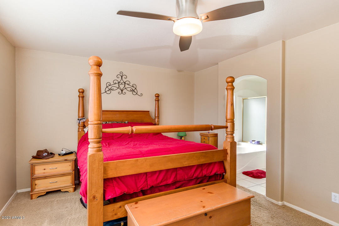 1163 East Ranch Court Gilbert, AZ 85296 - Photo 14 of 36 a bedroom with a bed and a dresser