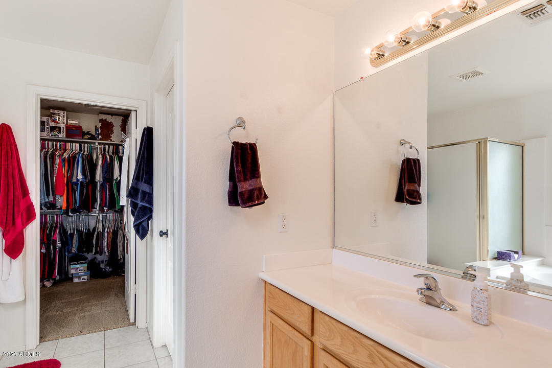 1163 East Ranch Court Gilbert, AZ 85296 - Photo 18 of 36 a bathroom with a sink and a mirror