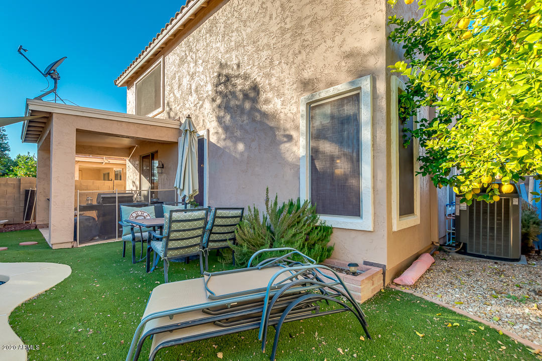 1163 East Ranch Court Gilbert, AZ 85296 - Photo 29 of 36 a view of a chair and table in backyard of the house