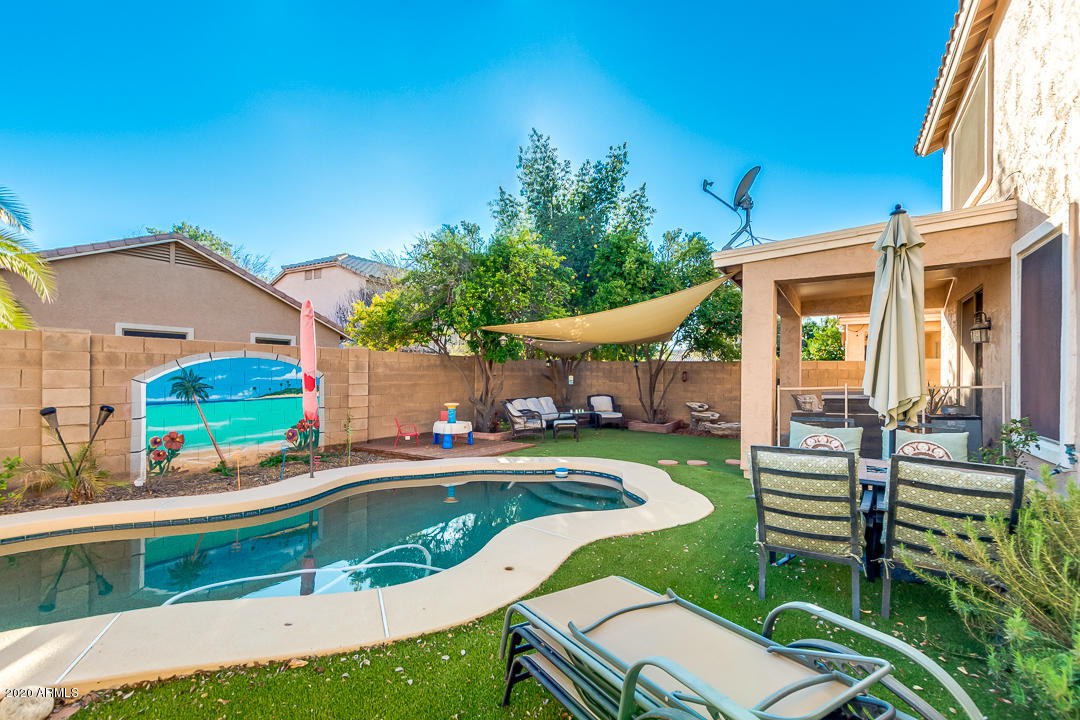 1163 East Ranch Court Gilbert, AZ 85296 - Photo 30 of 36 a view of a house with a yard