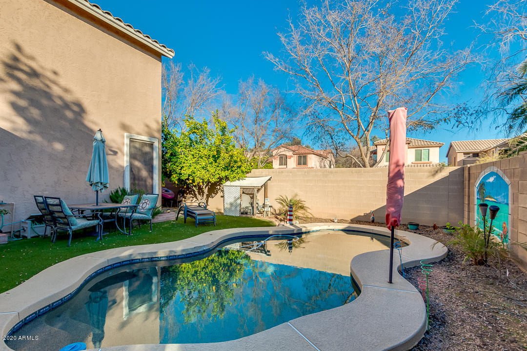 1163 East Ranch Court Gilbert, AZ 85296 - Photo 34 of 36 a view of a swimming pool with a patio