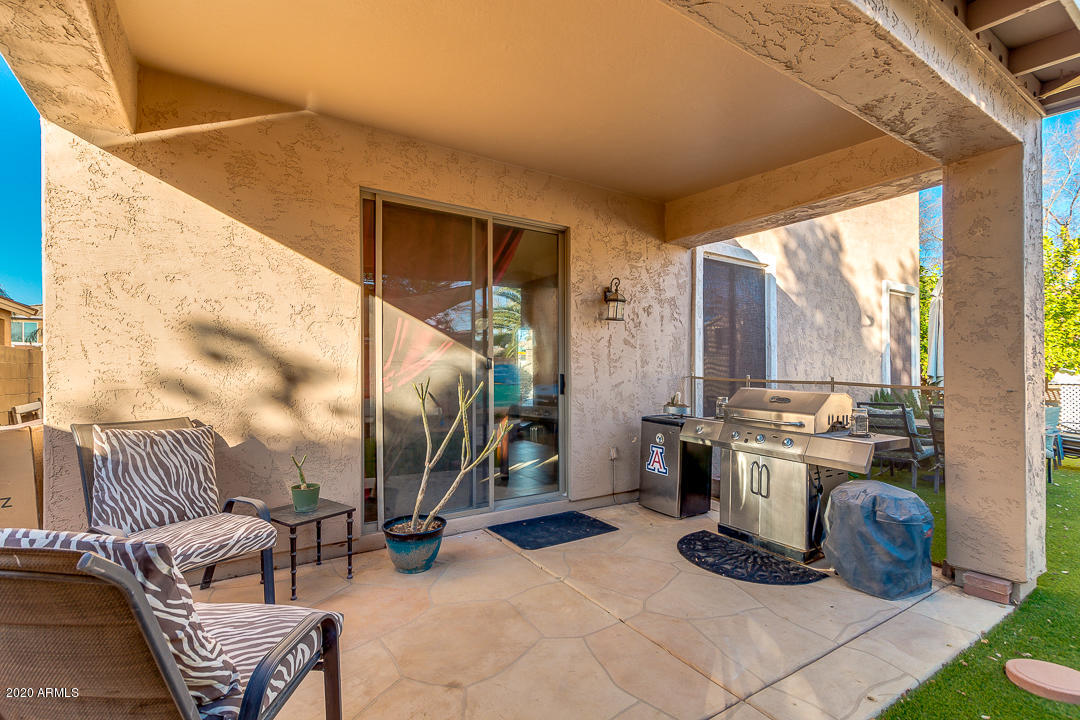 1163 East Ranch Court Gilbert, AZ 85296 - Photo 35 of 36 a view of living room with patio furniture and a grill