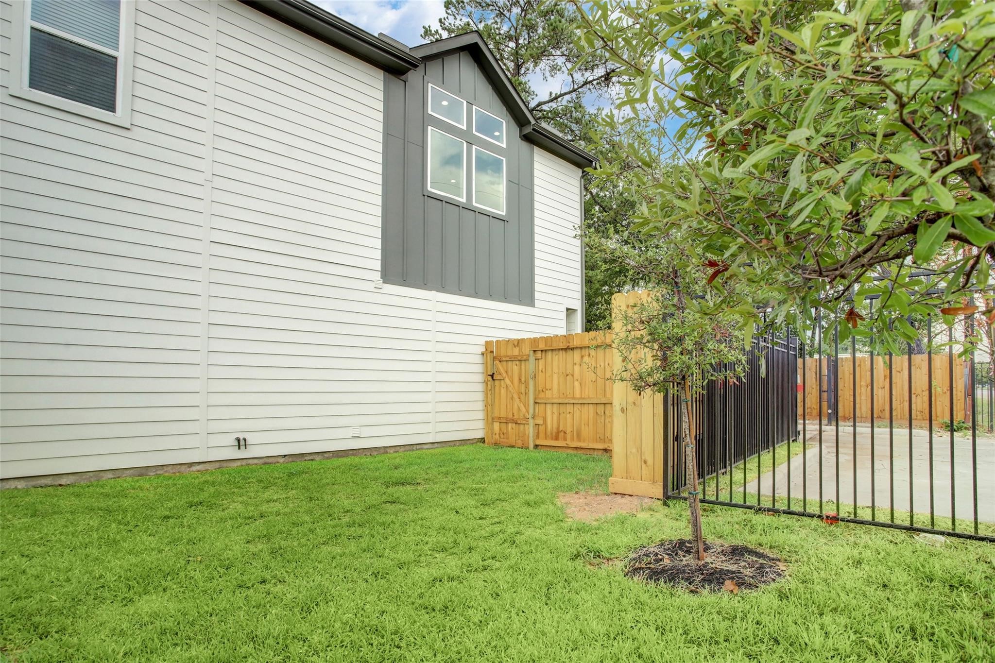 2502 West Tidwell Road, Unit A Houston, TX 77091 - Photo 2 of 22 a white house that has tree in front of it
