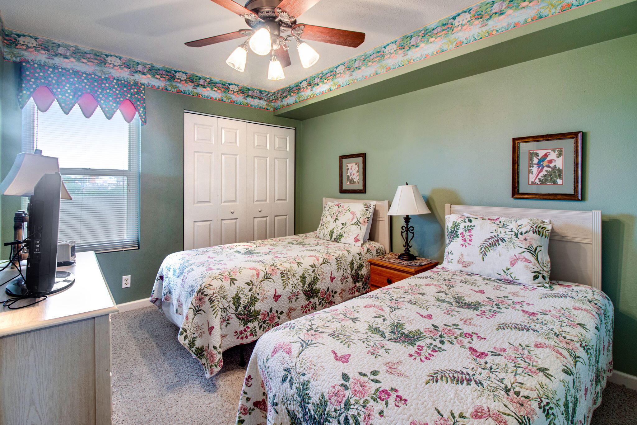 970 Highway 98, Unit 303 Destin, FL 32541 - Photo 30 of 42 a bedroom with two beds and a chandelier