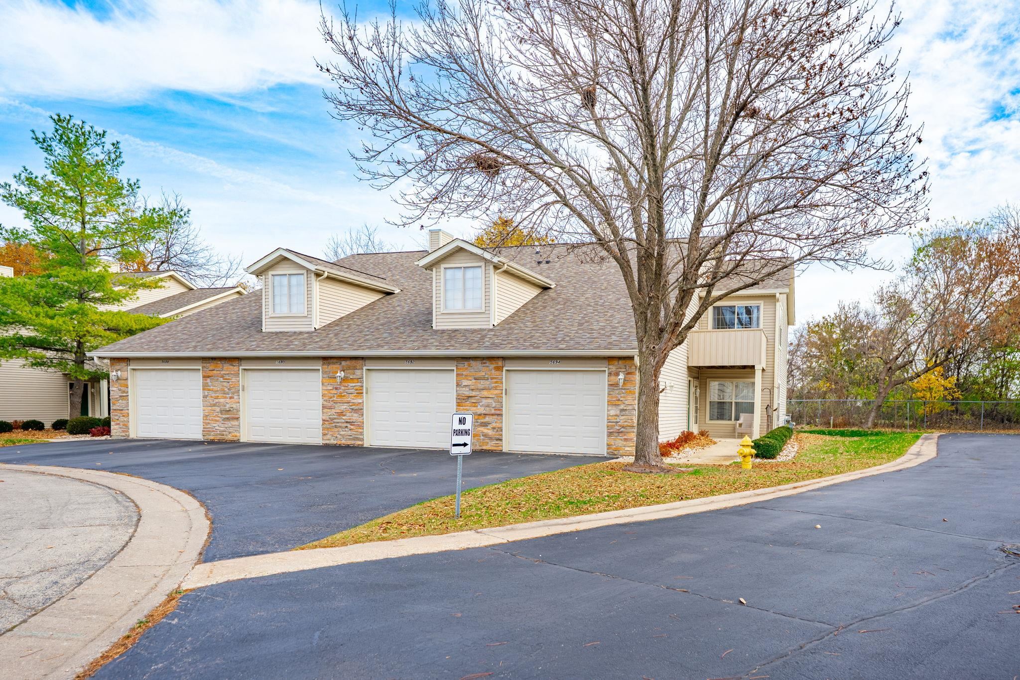 5694 Oak Village Drive Roscoe, IL 61073 - Photo 1 of 22 a view of house with outdoor space and large trees