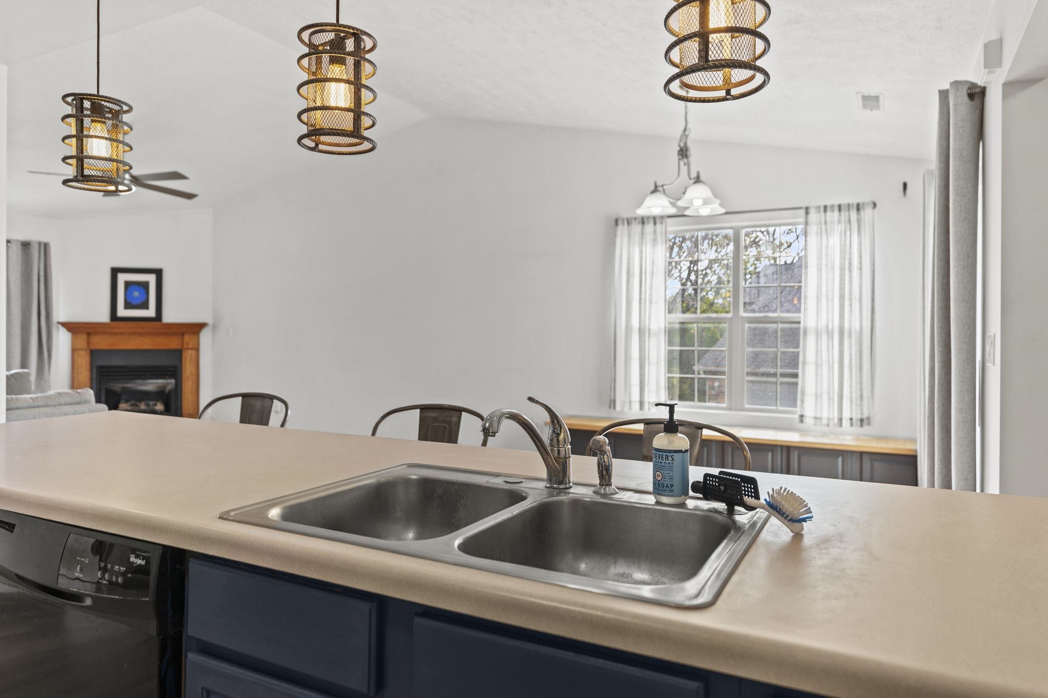 5694 Oak Village Drive Roscoe, IL 61073 - Photo 11 of 22 a kitchen with a sink and a window
