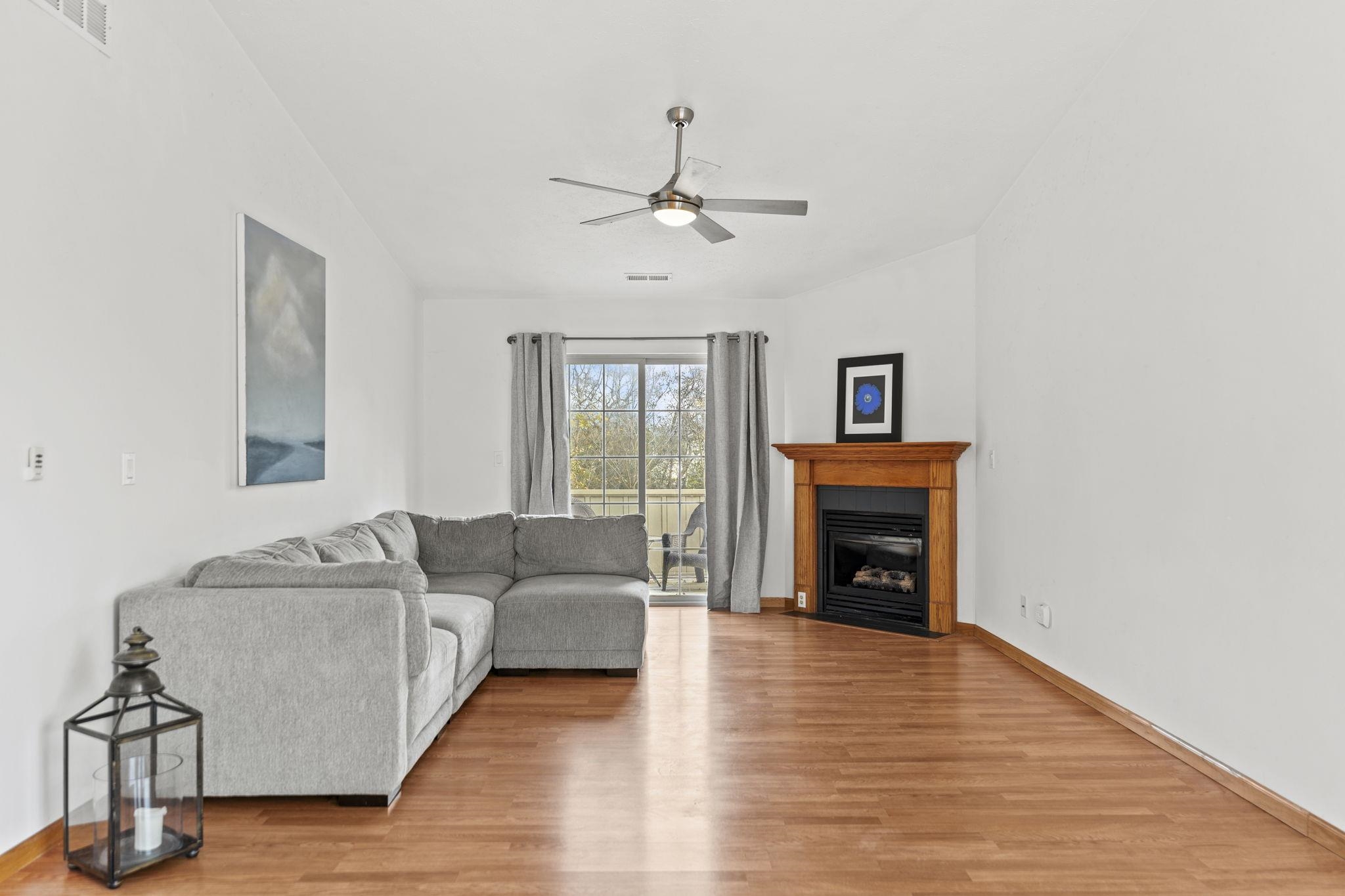 5694 Oak Village Drive Roscoe, IL 61073 - Photo 6 of 22 a living room with furniture and a fireplace