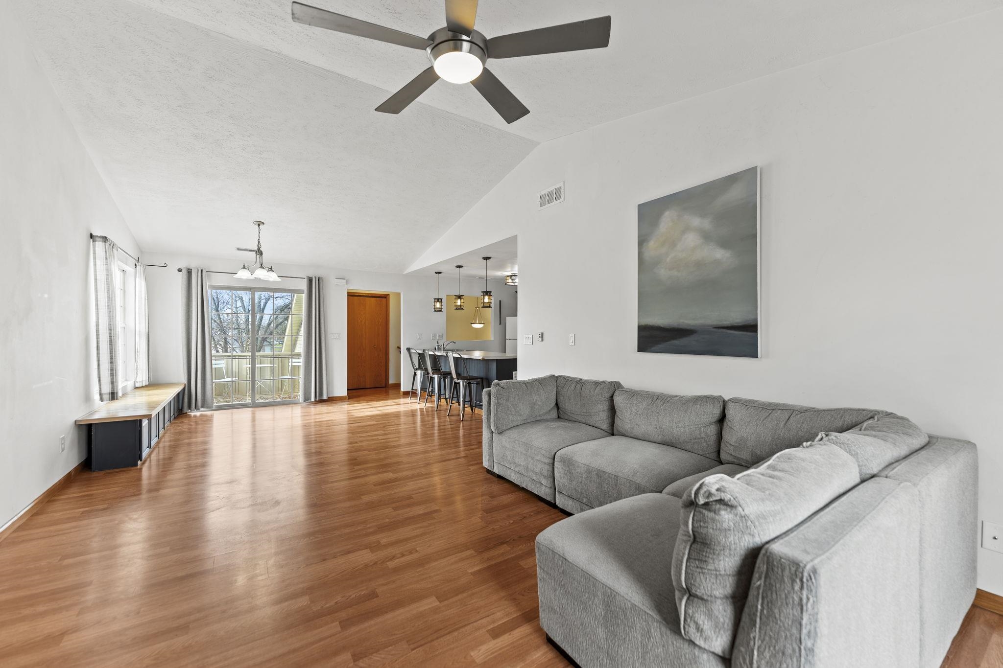 5694 Oak Village Drive Roscoe, IL 61073 - Photo 7 of 22 a living room with furniture and a wooden floor