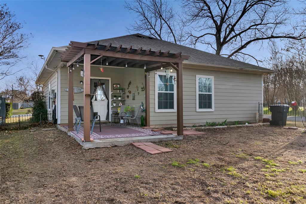 201 East Walker Street Denison, TX 75021 - Photo 18 of 19 a view of a house with a yard