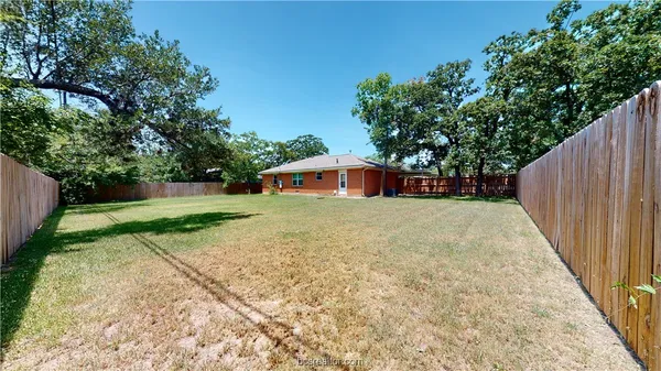 a view of a backyard with a small cabin