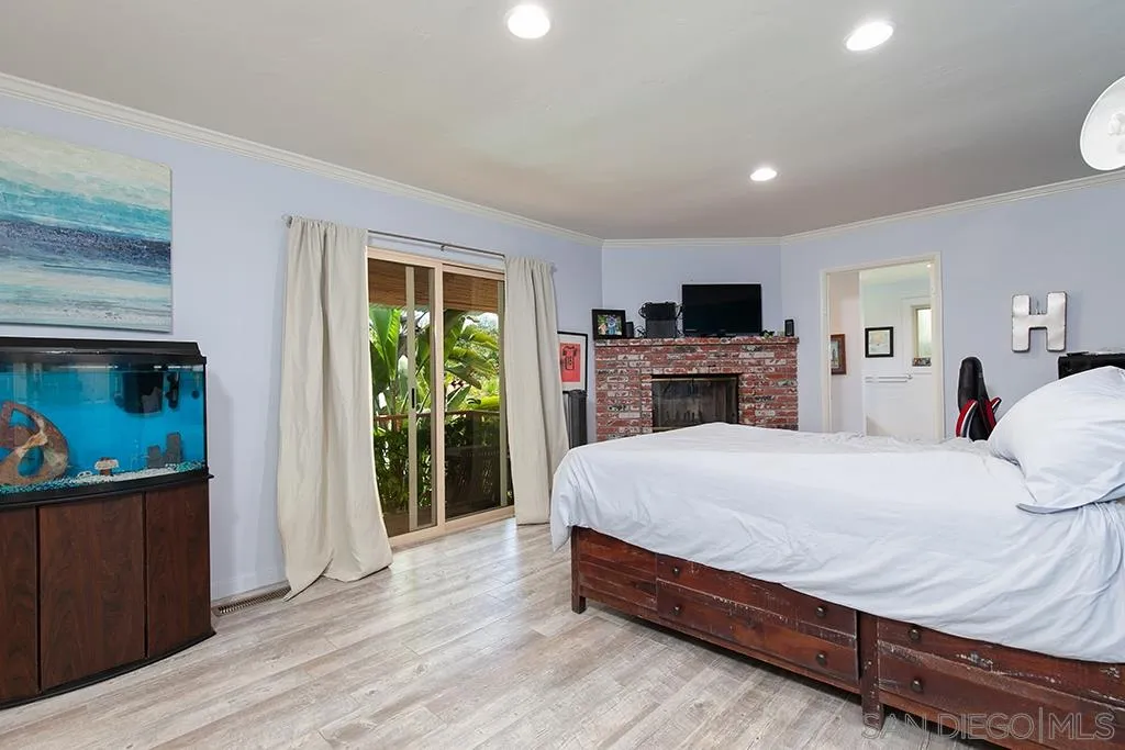 208 Rancho Santa Fe Road Encinitas, CA 92024 - Photo 23 of 45 a bed room with a bed and a television