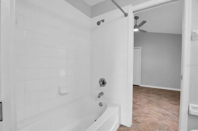 a view of an empty room with a window