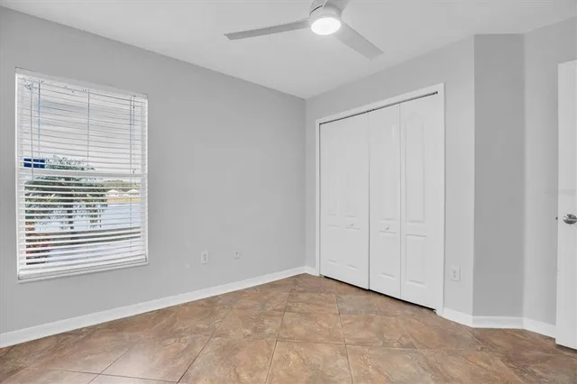 a view of an empty room and a window