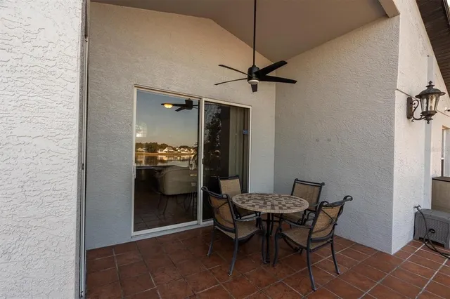 a view of house with backyard and outdoor seating