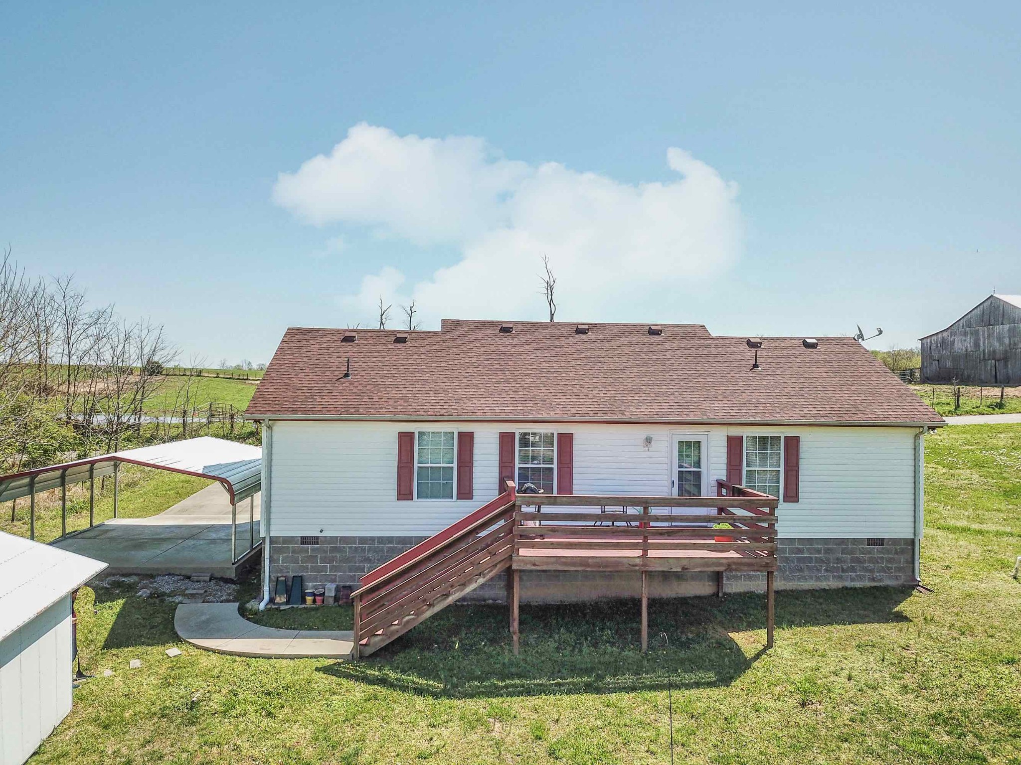 105 Tom Ferrell Road Portland, TN 37148 - Photo 3 of 31 a house view with a garden space