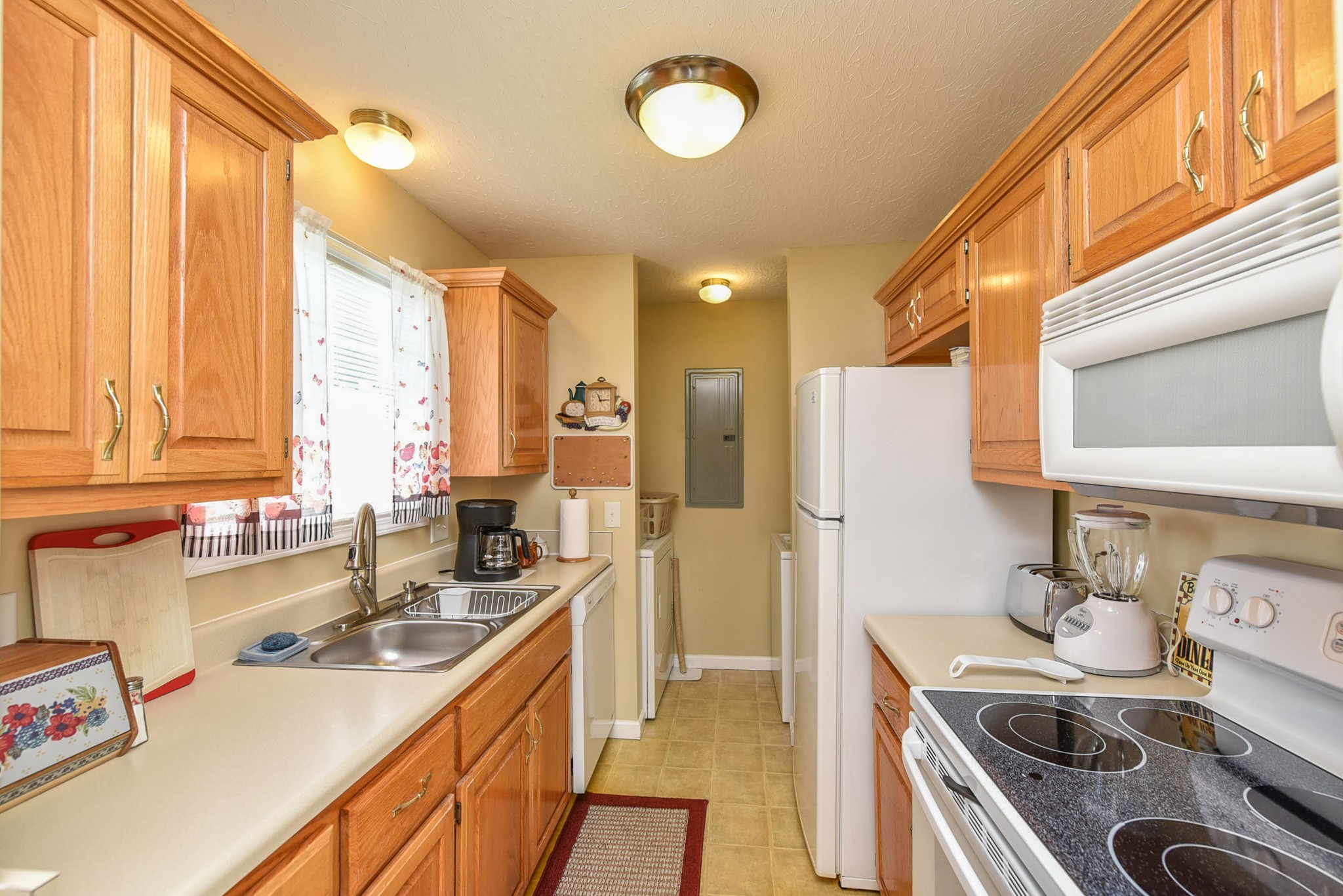 105 Tom Ferrell Road Portland, TN 37148 - Photo 22 of 31 a kitchen that has a sink a stove and a refrigerator