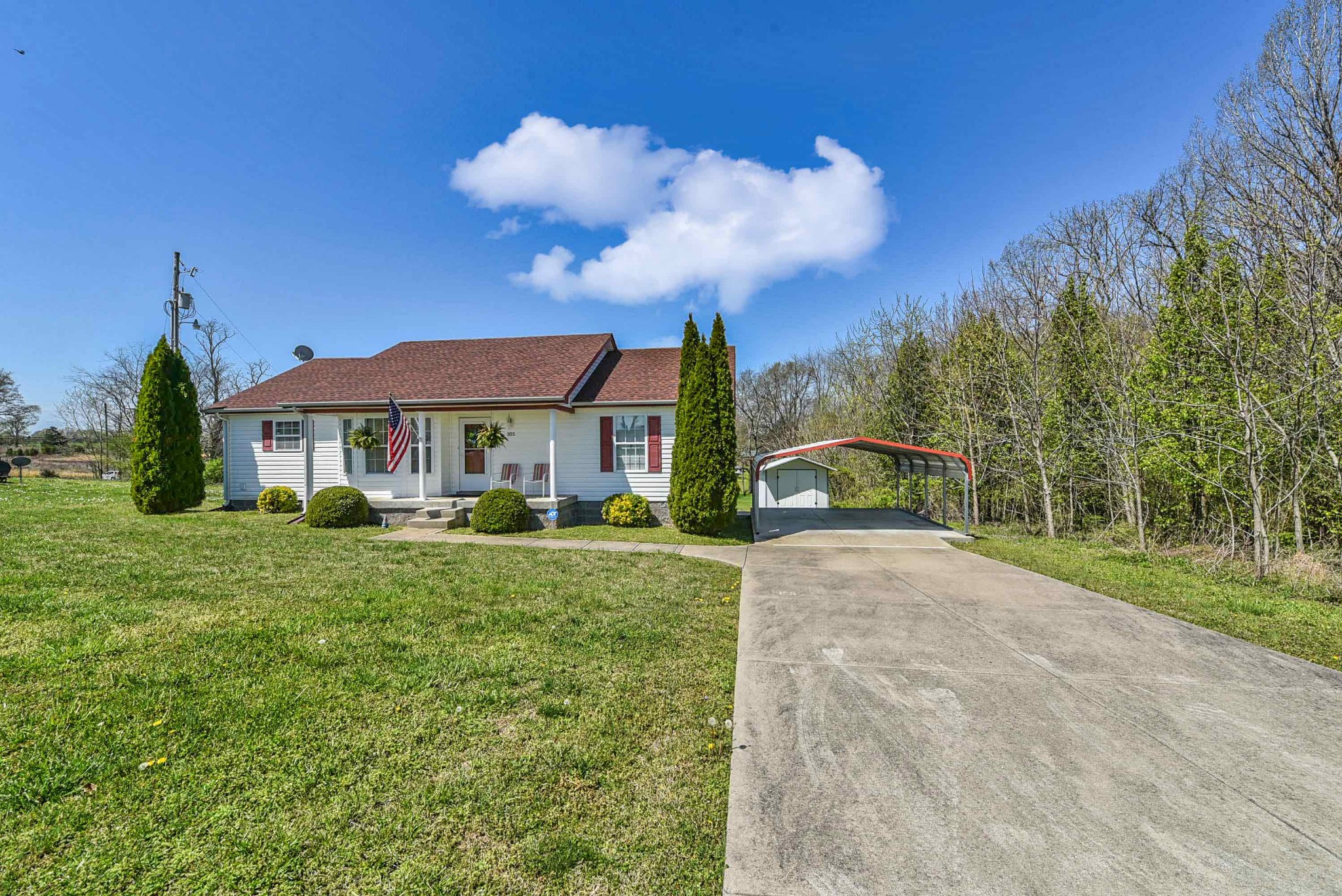 105 Tom Ferrell Road Portland, TN 37148 - Photo 8 of 31 a front view of a house with a yard and trees